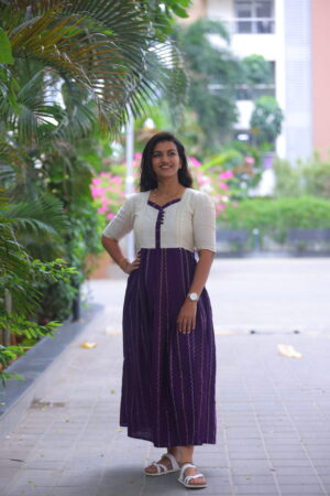 Woman wearing a purple striped cotton maternity maxi dress with ivory yoke, feeding-friendly front buttons – Aayizhai Fashions.