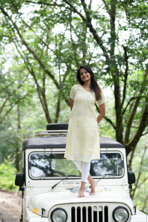 "Yellow linen cotton kurti with subtle floral prints – Aayizhai Fashions"